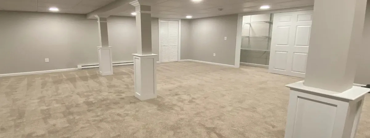 Finished basement with paneled columns in West Hartford, CT