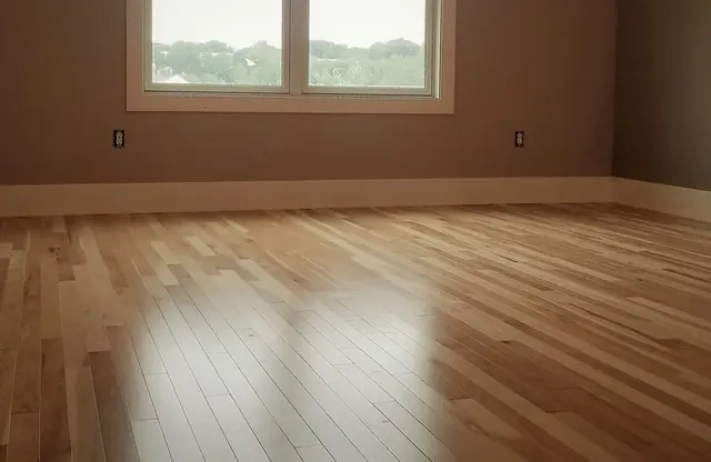 Natural hickory hardwood flooring in an attic conversion in Bristol, CT